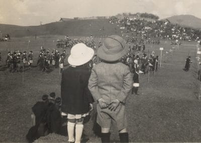 Bea and her brother watching tribal dance